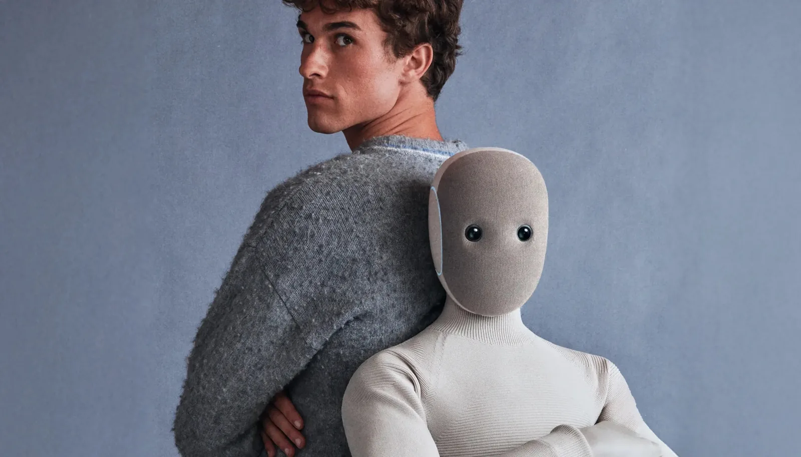 Person holding a soft humanoid robot